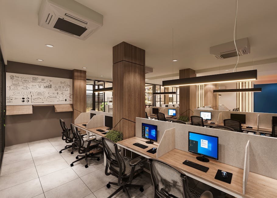 Contemporary open office space with cubicles, computers, and a creative whiteboard wall in a professional setting